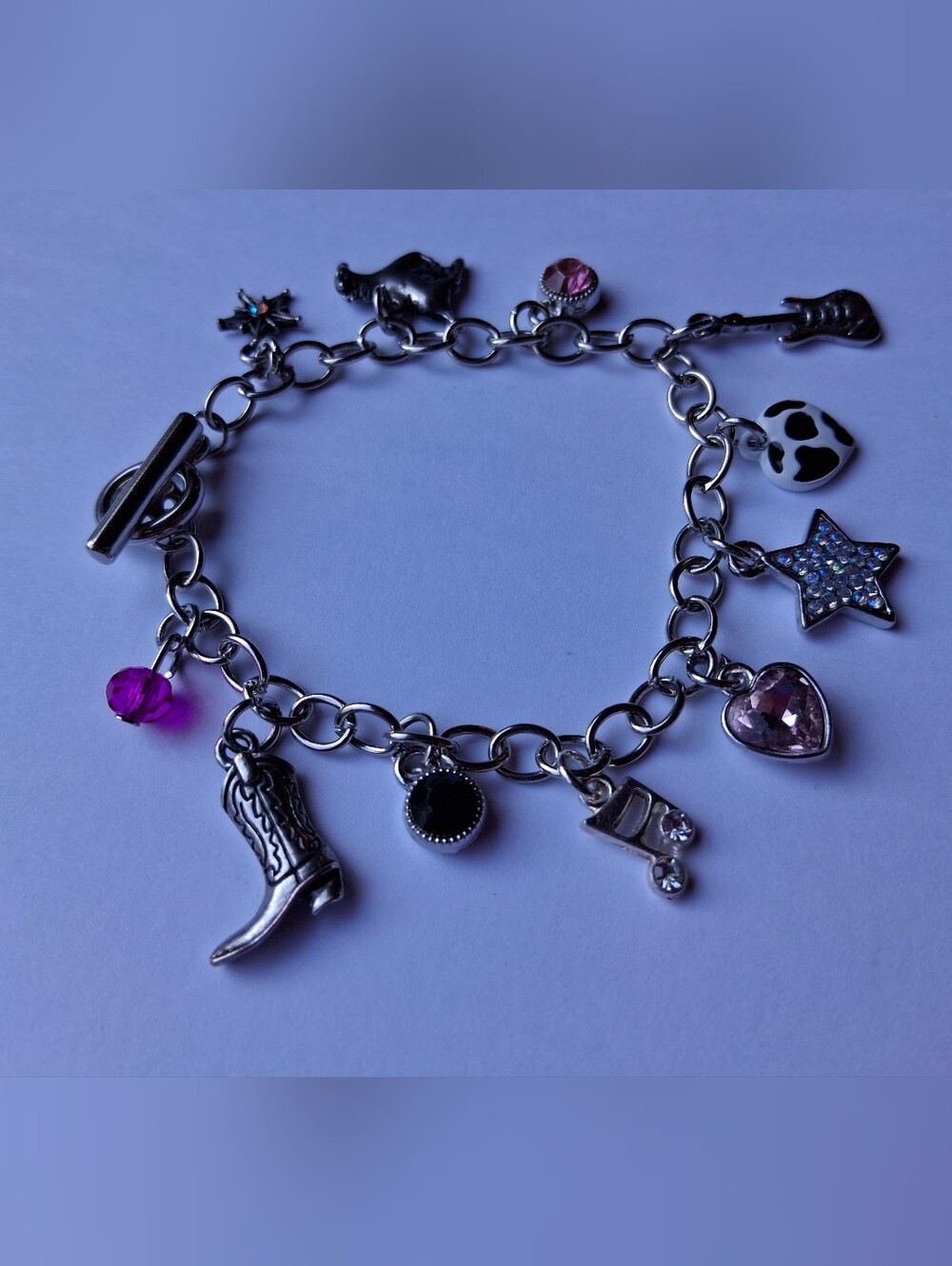 Hand Crafted Silver Charm Bracelet with Pink and Purple Accents